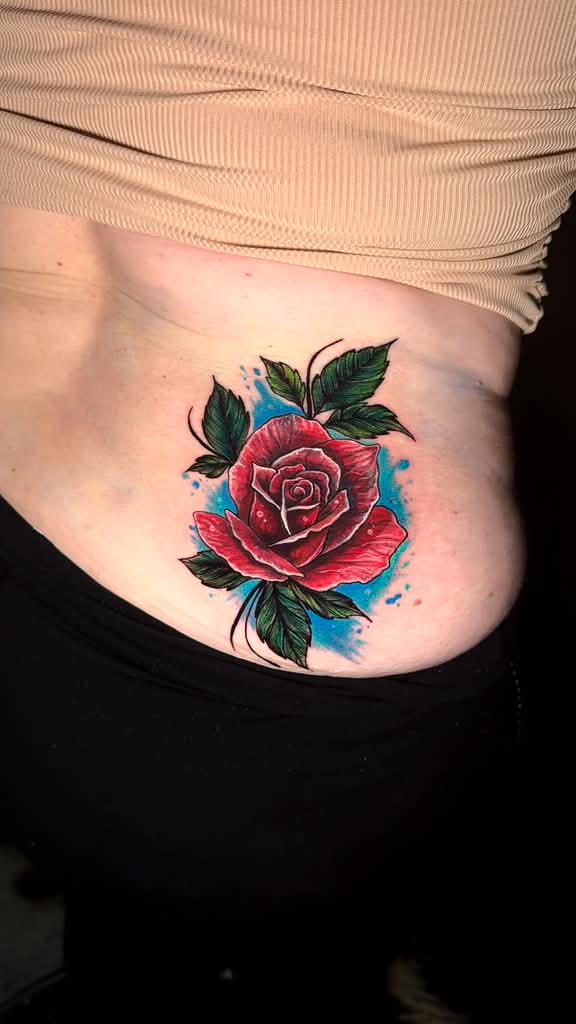 Crimson Bloom — color tattoo by Nemo Tattoo Studio